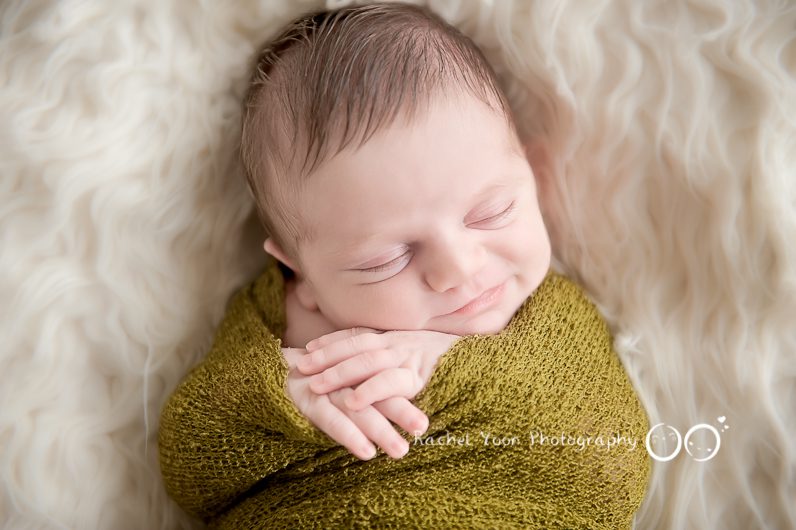 newborn photography vancouver - smily newborn baby