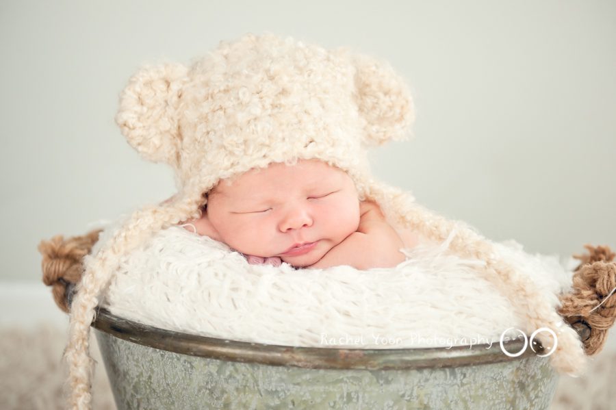 newborn baby boy in a bucket - newborn photography vancouver