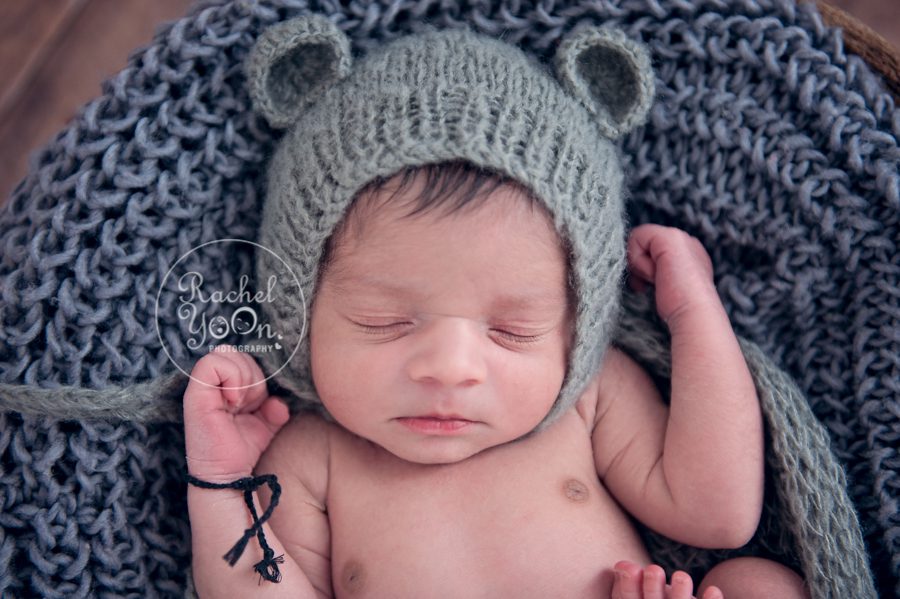 newborn baby boy with a grey bear hat - newborn photography vancouver