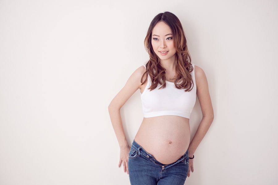 maternity pose in casual jeans - maternity photography vancouver