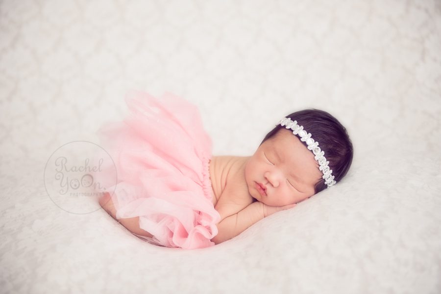 newborn baby girl in a bum up pose with tutu - newborn photography vancouver