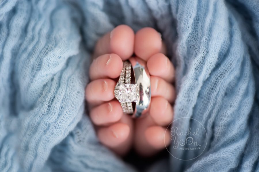 newborn baby boy feet with parents' rings - newborn photography vancouver