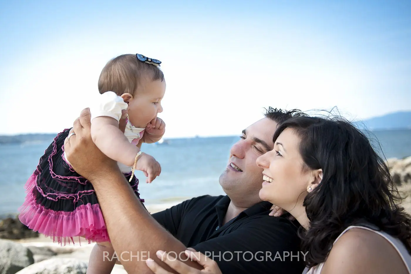 6 months old baby girl with her mom and dad