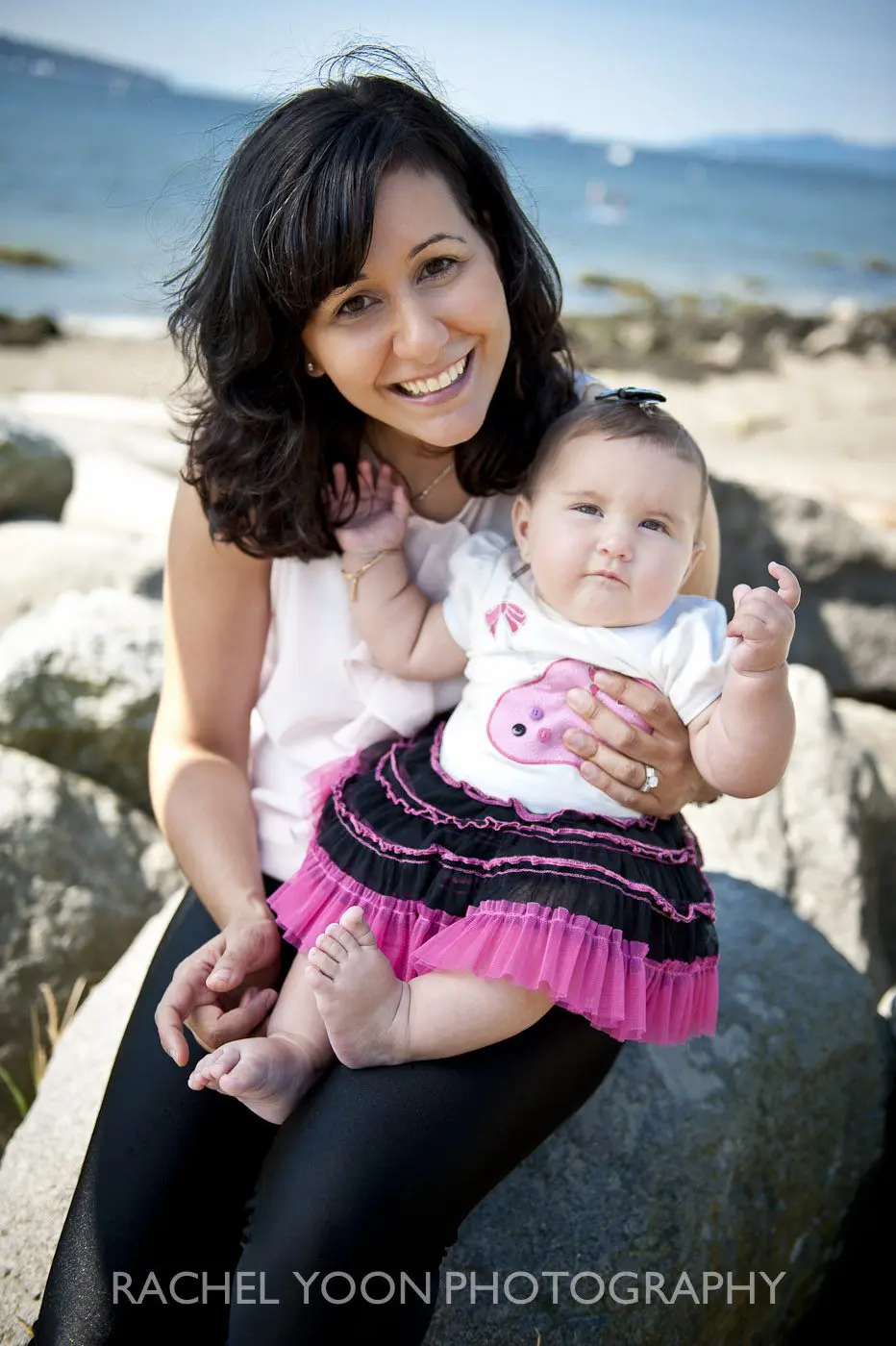 6 months old baby girl with her mom