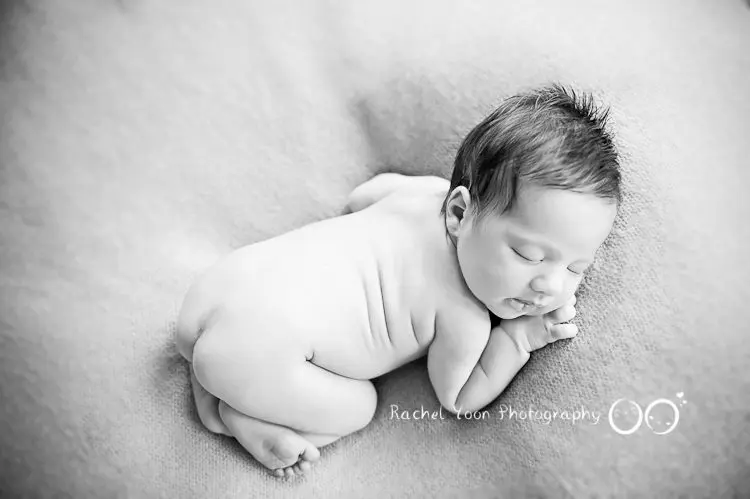 newborn baby girl in black and white