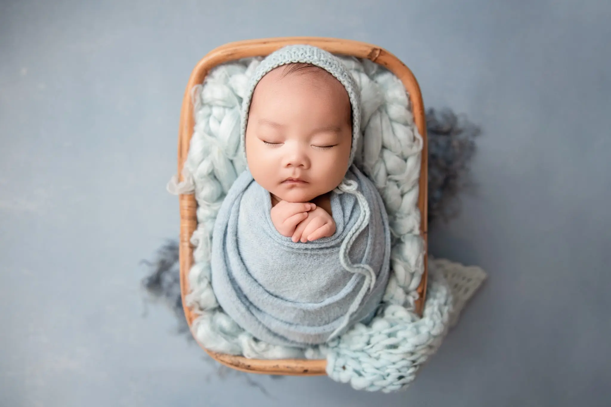 newborn photography vancouver - newborn baby wrapped in blue