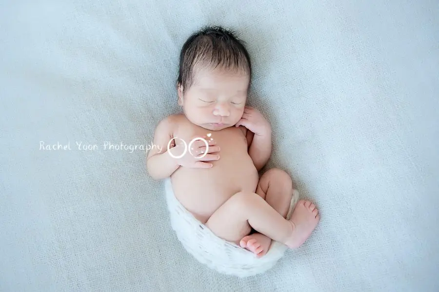 newborn photography vancouver - newborn baby boy on a beanbag
