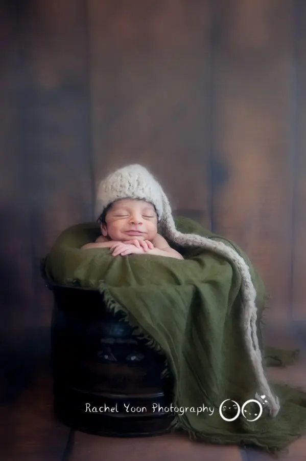 newborn baby boy in a bucket - newborn photography vancouver