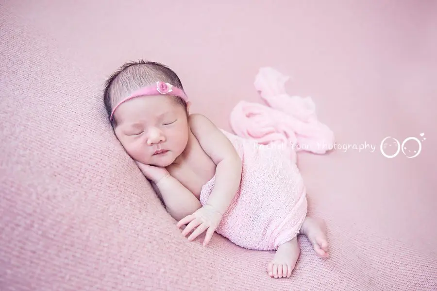 newborn baby girl wrapped in pink - newborn photography vancouver