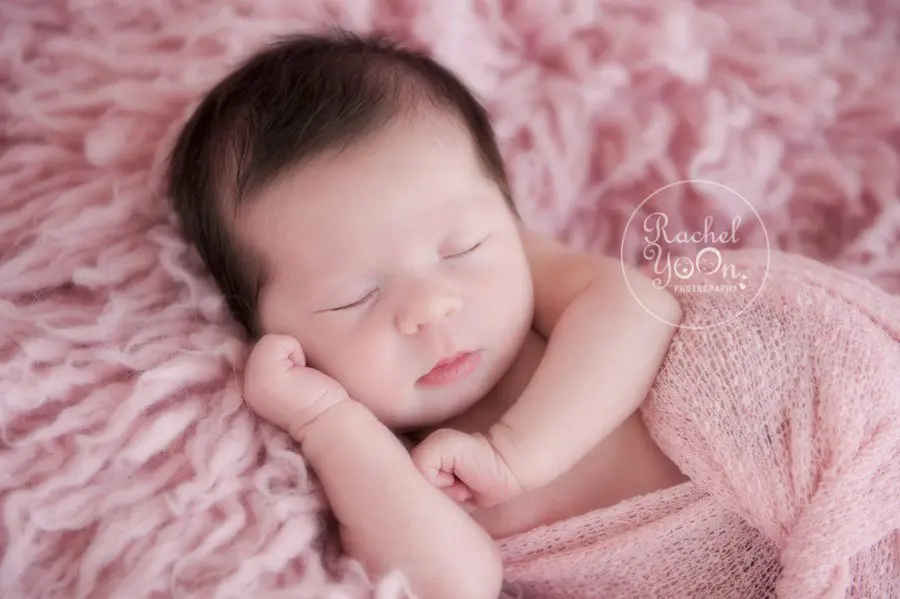newborn baby girl wrapped in pink - newborn photography vancouver