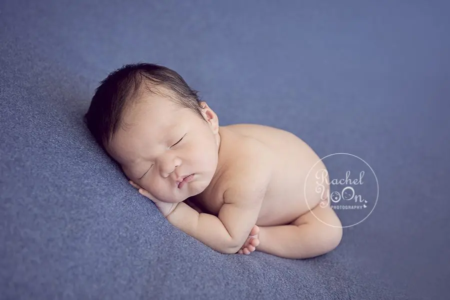 newborn baby boy on a blue fabric - Vancouver Newborn Photographer