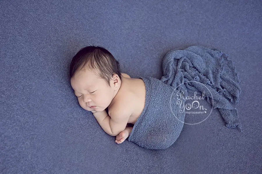 newborn baby boy on a blue fabric - Vancouver Newborn Photographer