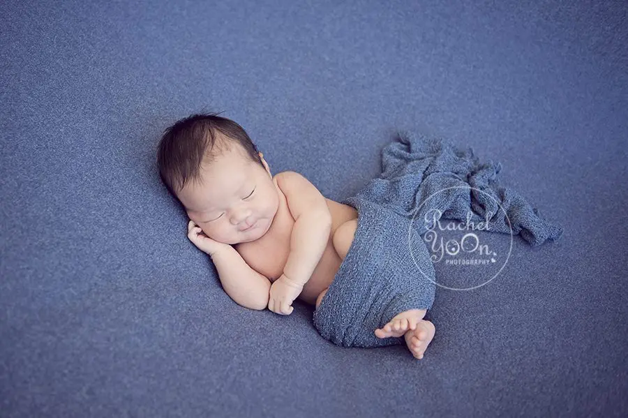 newborn baby boy on a blue fabric - Vancouver Newborn Photographer
