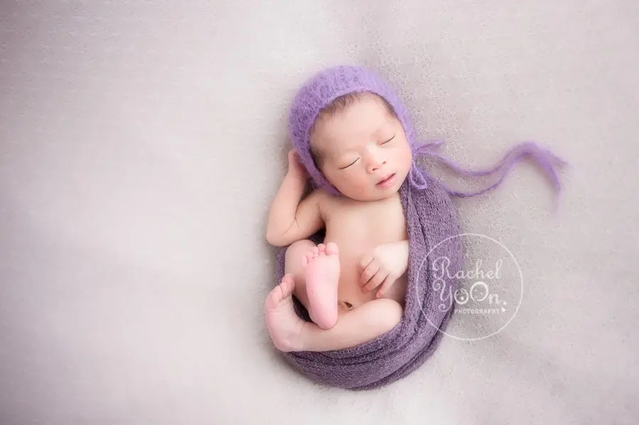 newborn baby girl on a bean bag - Newborn Photography Vancouver