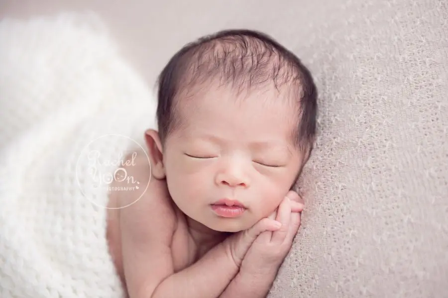 newborn baby girl on a bean bag - Newborn Photography Vancouver
