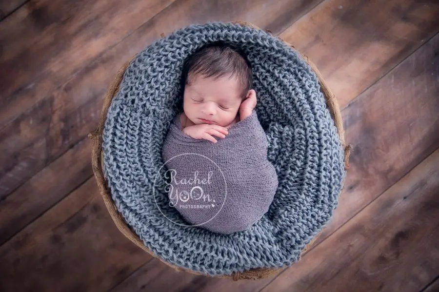 newborn baby boy in a basket - newborn photography vancouver
