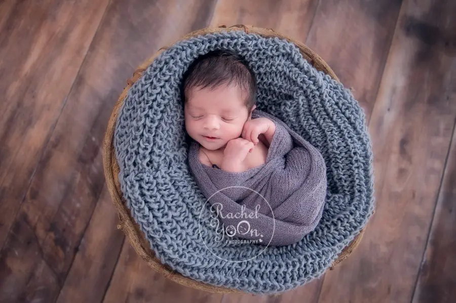 newborn baby boy in a basket - newborn photography vancouver