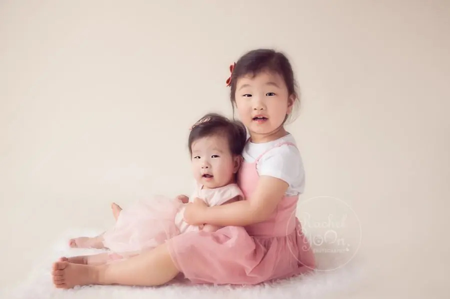 6 months old baby with her sibling - baby photography vancouver
