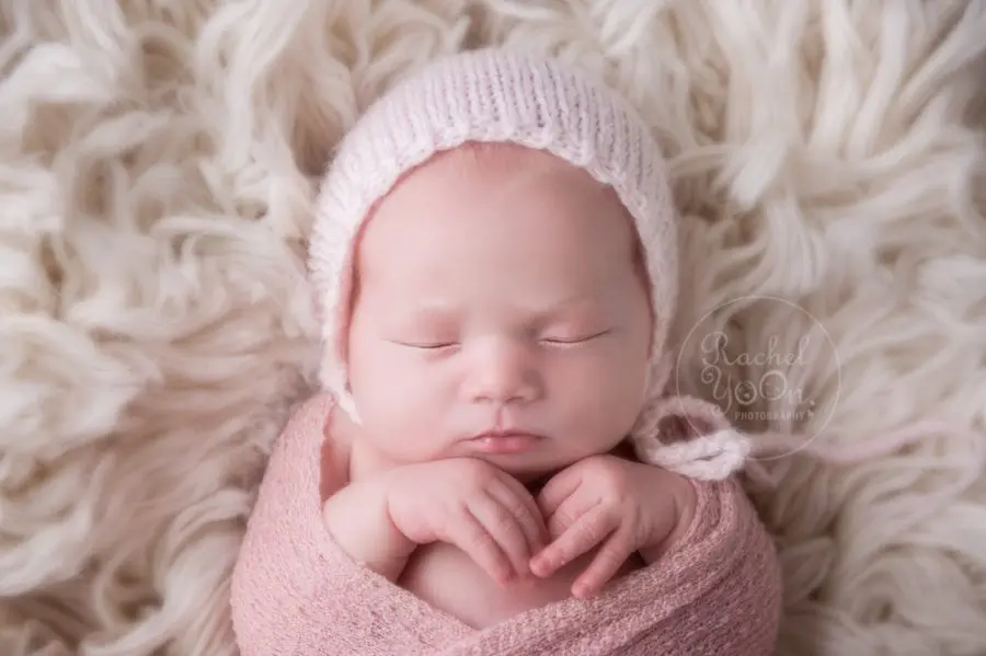 newborn baby girl wrapped in pink - newborn photography vancouver