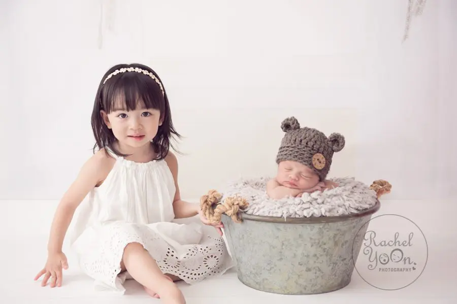 newborn baby boy with a sibling - newborn photography vancouver