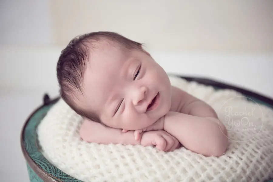 newborn baby girl smiling - newborn photography vancouver
