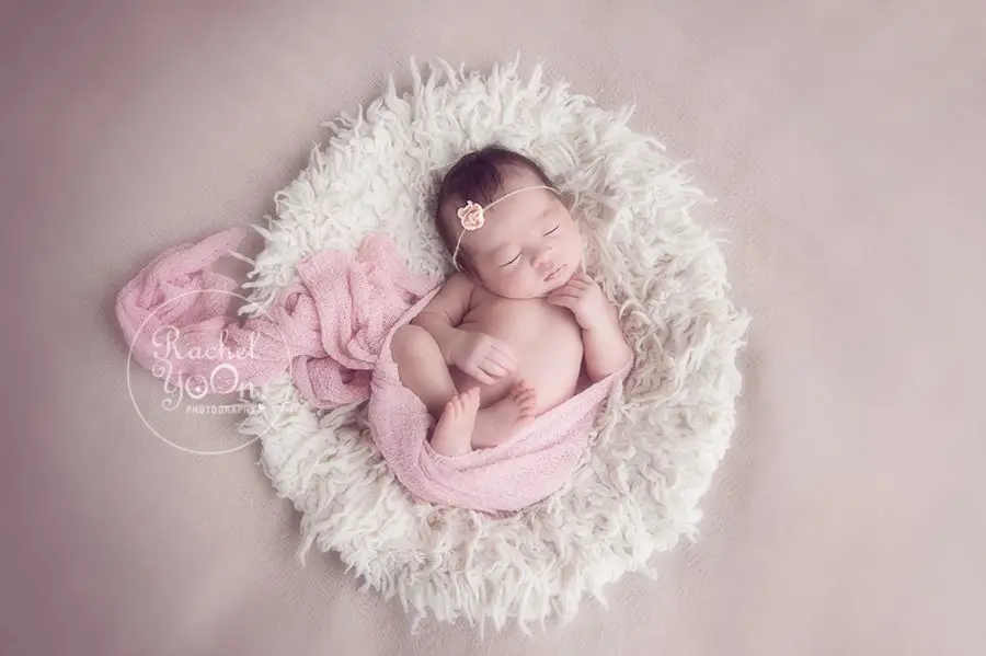 newborn baby girl in a pink wrap - newborn photography vancouver