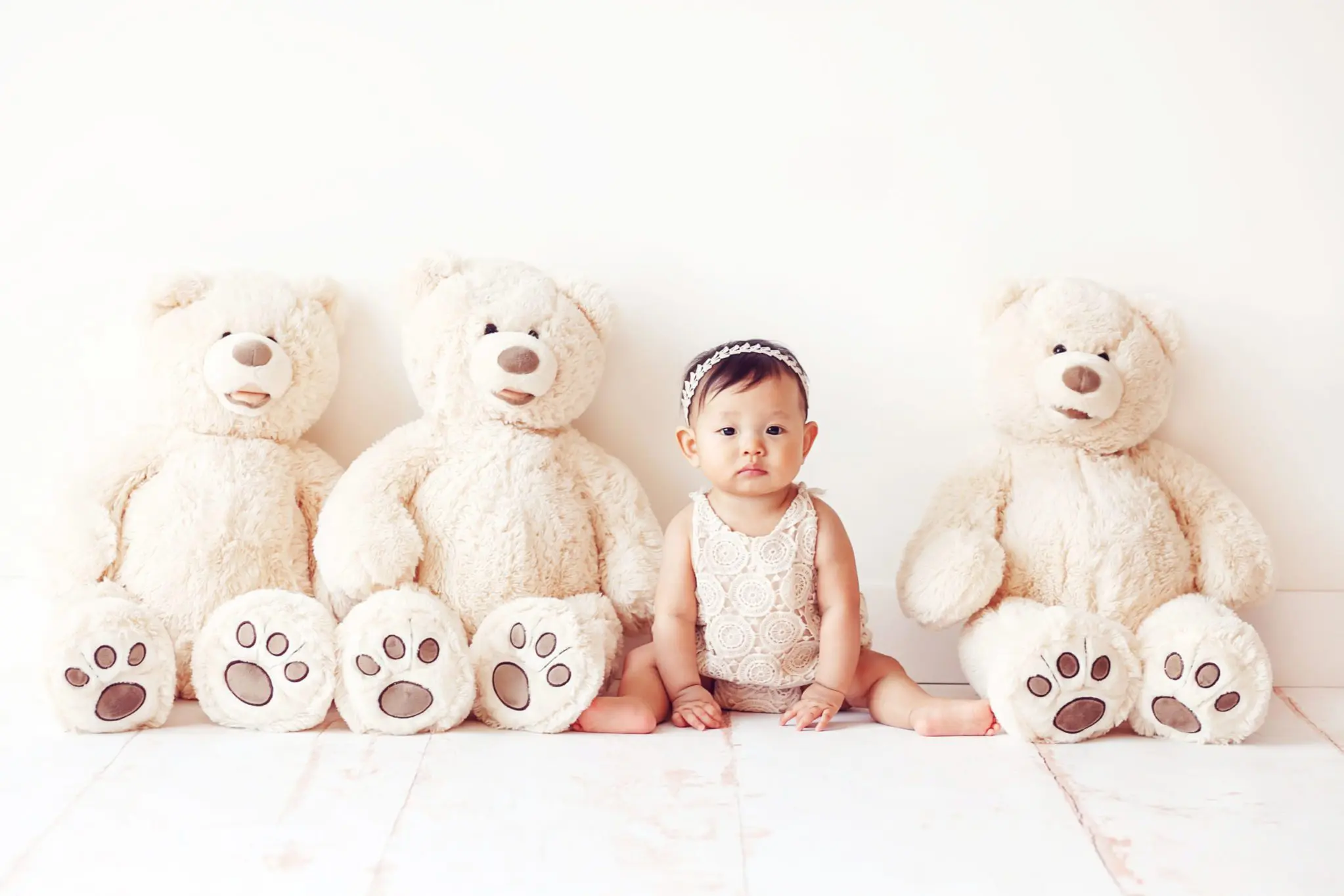sitter session - baby with three Teddy bears