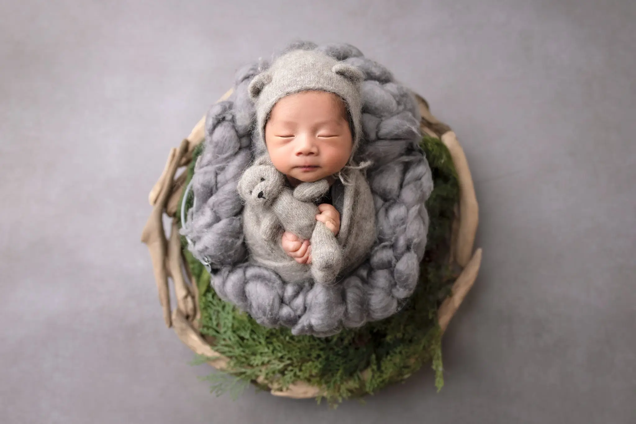 newborn lying in a bucket