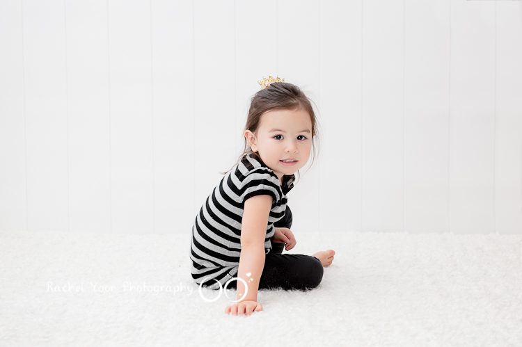 photo of a cute baby girl with white backdrop