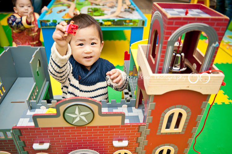 a child playing in a toy house