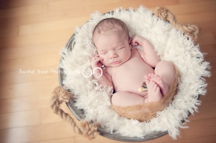 newborn photography vancouver - baby boy propped in a basket