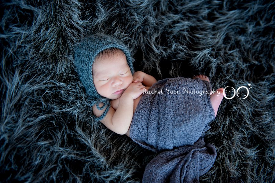 newborn photography vancouver - newborn baby boy wrapped in blue