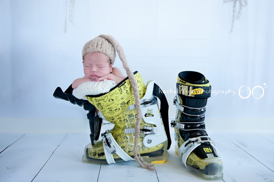 newborn photography vancouver - newborn baby boy propped in boots
