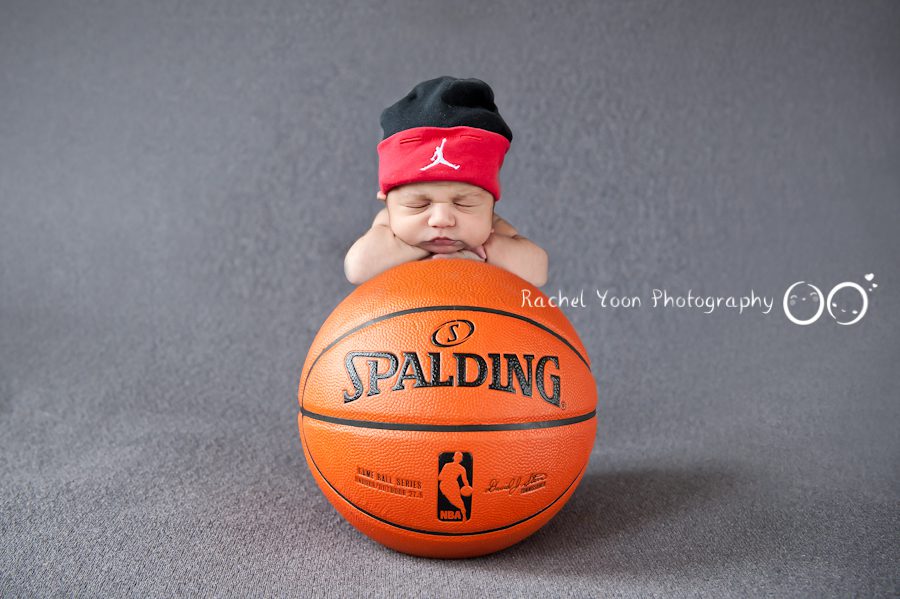 newborn photography vancouver - newborn baby boy with a basketball