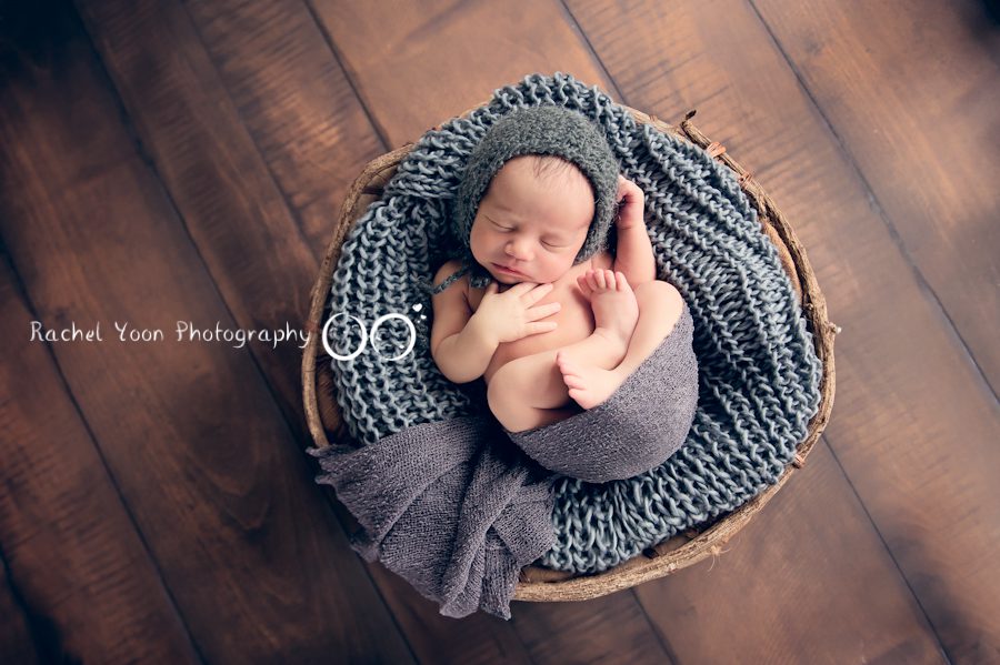 newborn photography vancouver - newborn baby boy wrapped in a basket
