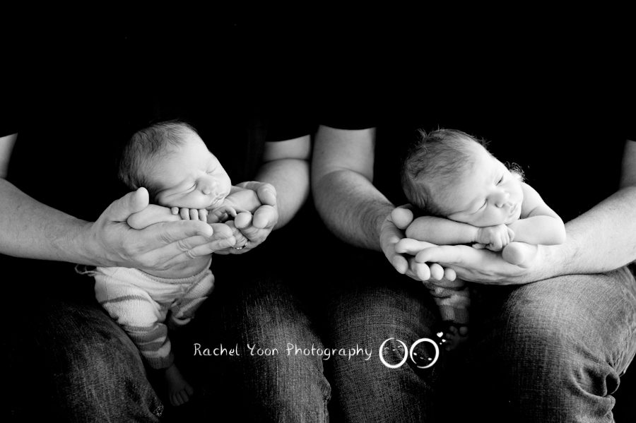Twins on parents' hands - Newborn Photography Vancouver