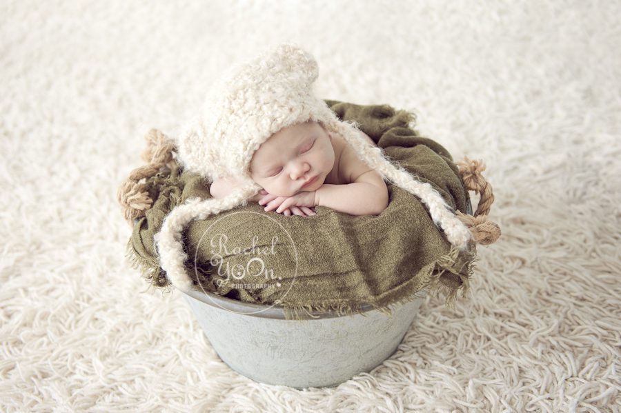 newborn baby boy posed in a metal bucket - newborn photography vancouver