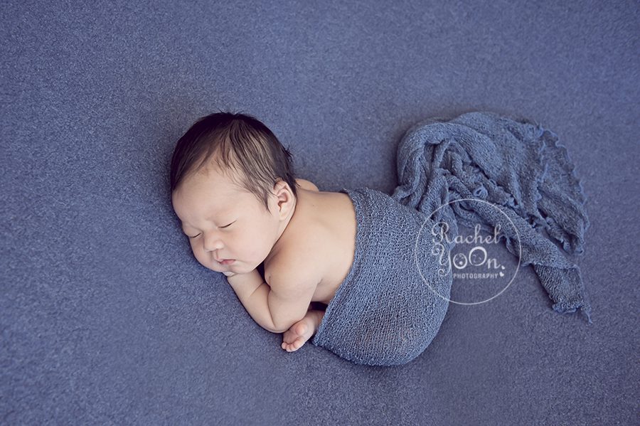 newborn baby boy on a blue fabric - Vancouver Newborn Photographer
