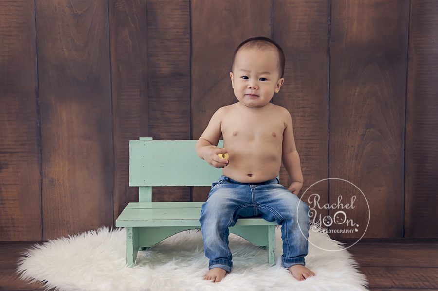 1 year old baby boy sitting on a bench - Baby Photography Vancouver