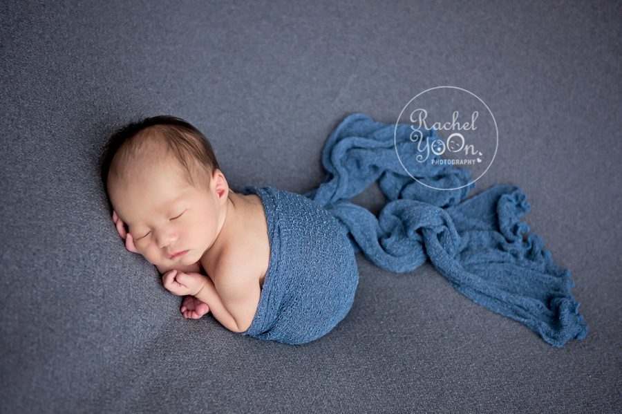 newborn baby boy wrapped in blue - Newborn Photography Vancouver