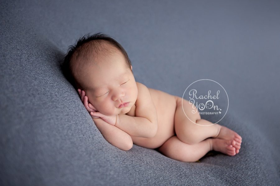 newborn baby boy on a bean bag - Newborn Photography Vancouver