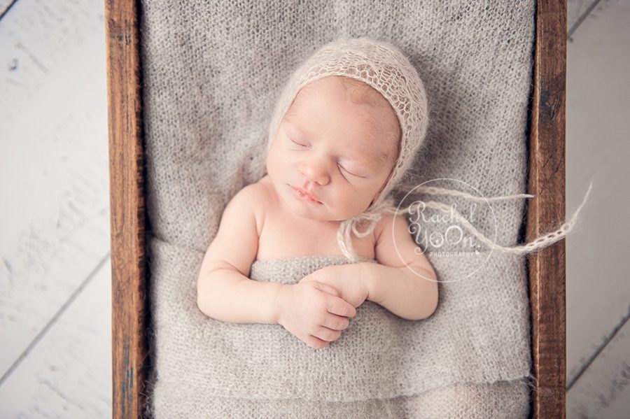 baby girl in a wooden box - Newborn Photography Vancouver