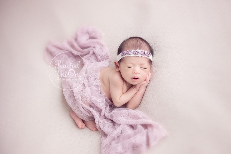 newborn baby girl on a bean bag - Newborn Photography Vancouver