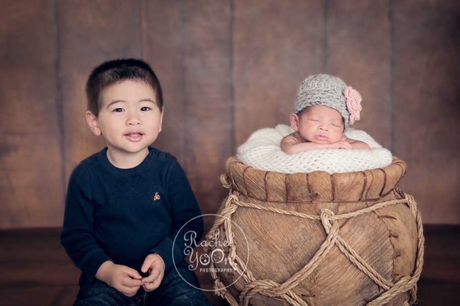 newborn baby girl with a sibling - Newborn Photography Vancouver