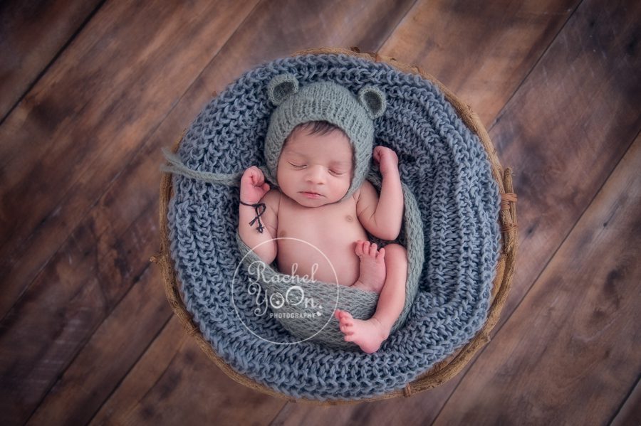 newborn baby boy in a basket - newborn photography vancouver