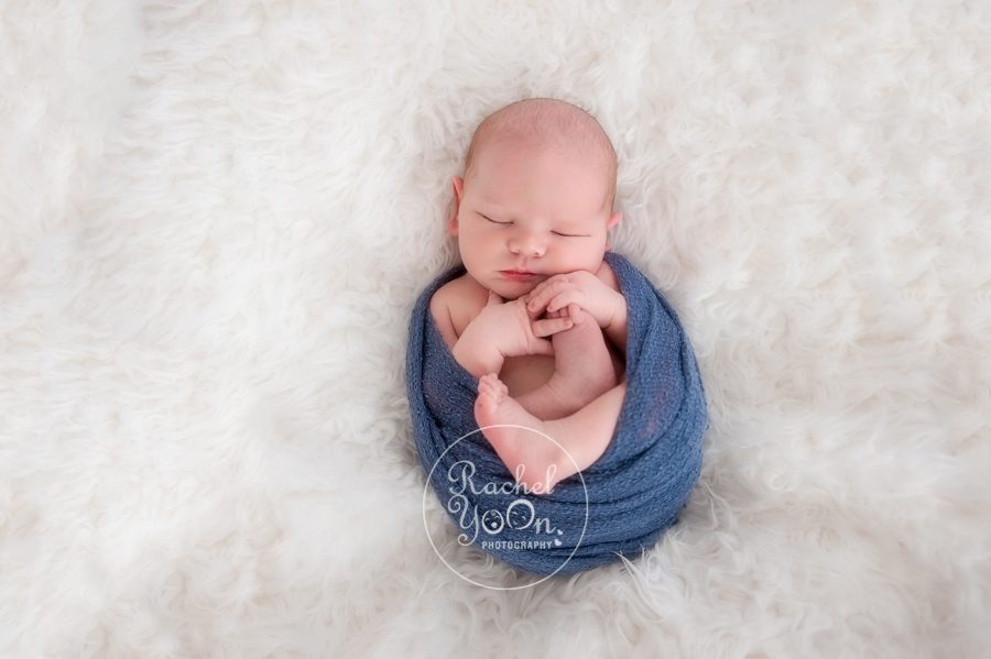 newborn baby boy wrapped in blue - newborn photography vancouver