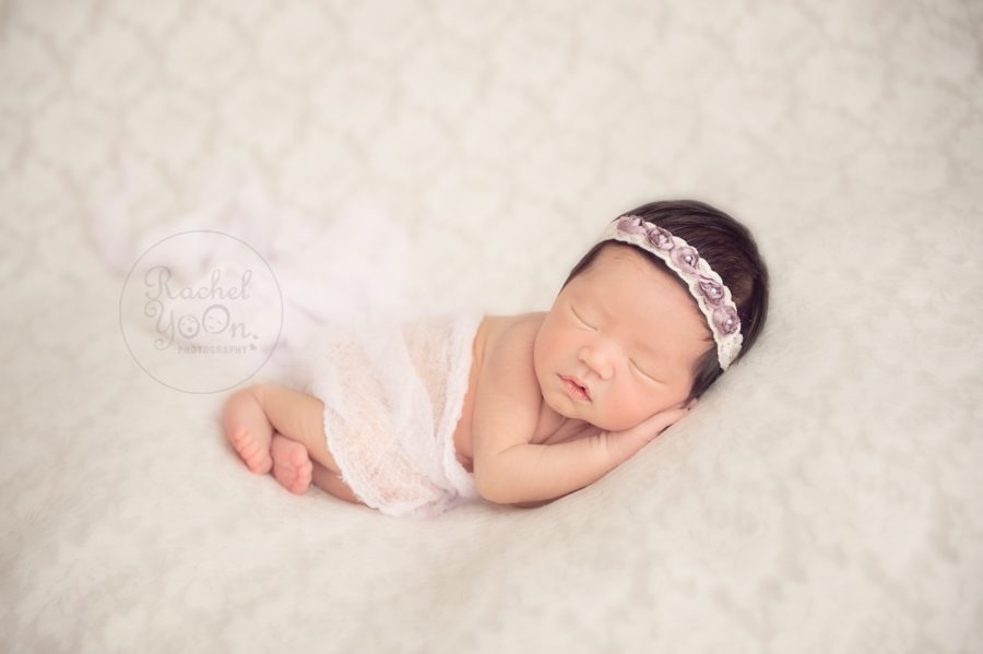 newborn baby girl on a bean bag - newborn photography vancouver