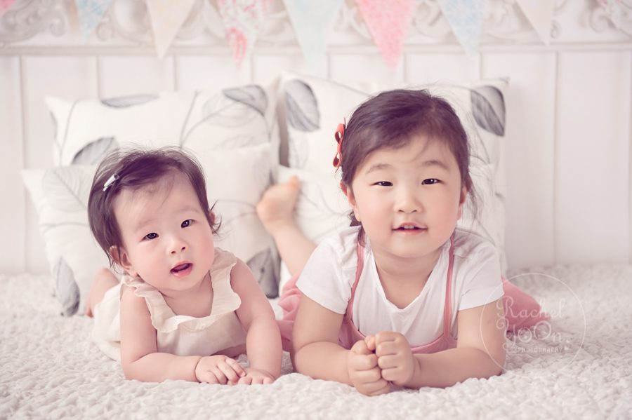 6 months old baby girl with her sister - baby photography vancouver