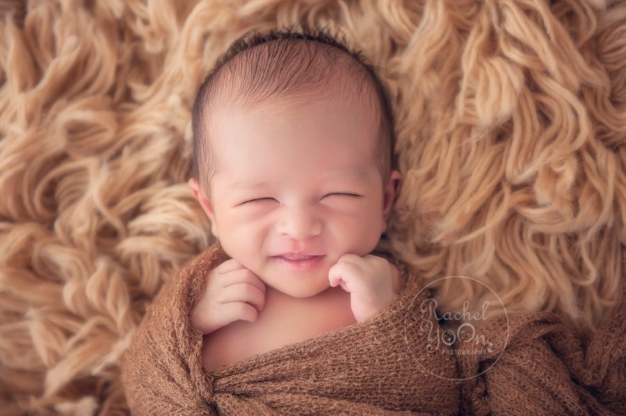 newborn baby boy smiling - newborn photography vancouver