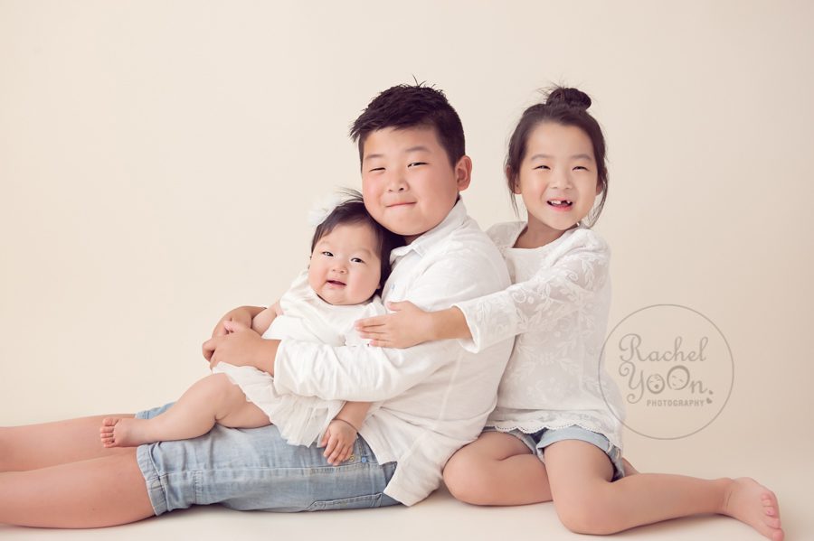 baby girl with her siblings - baby photography vancouver